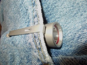 An Olight S15 w/pocket clip